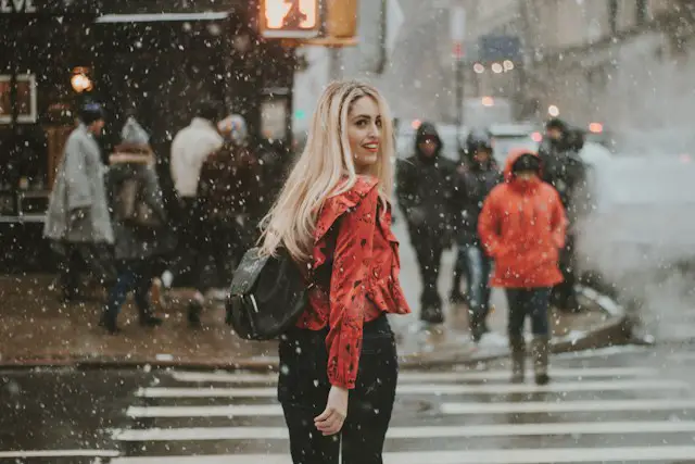 Woman walking down the street during winter