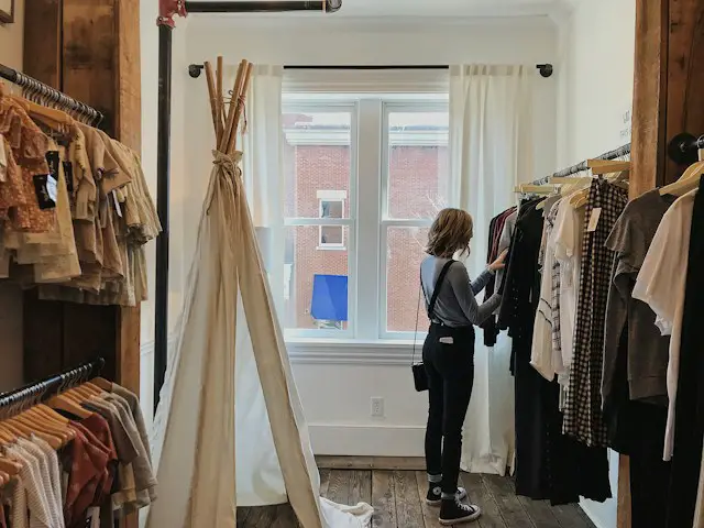 Woman browsing clothes in the clothing store